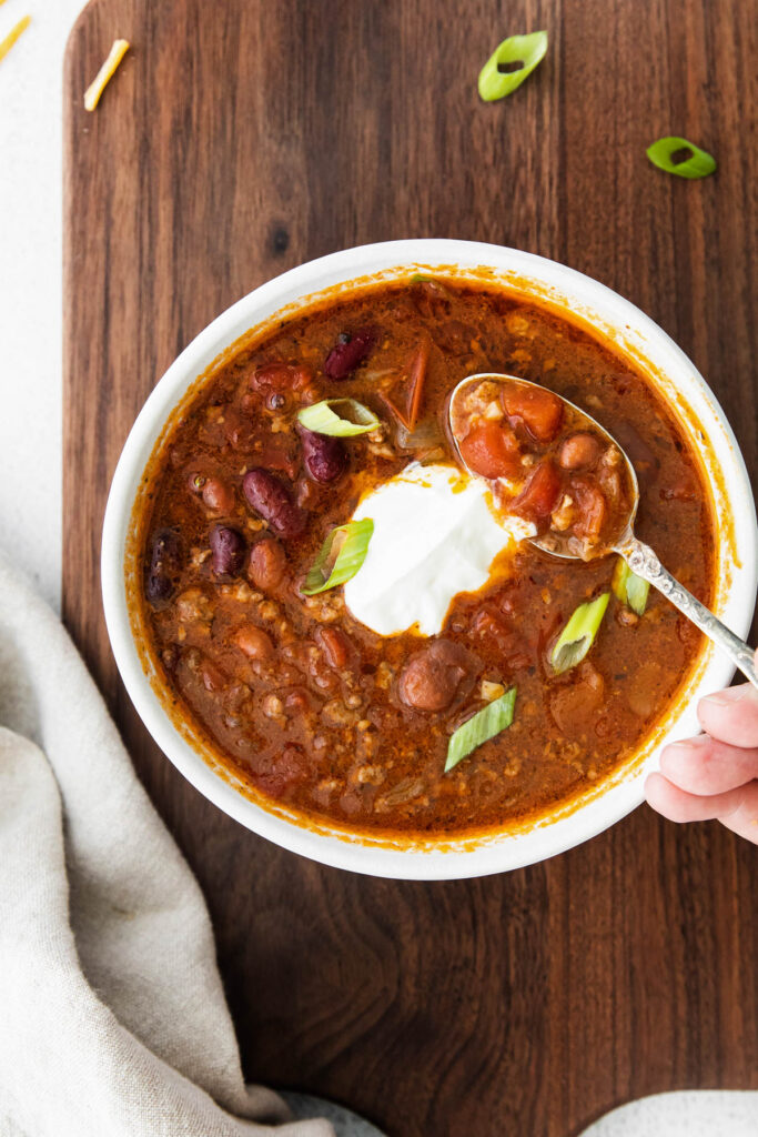 Slow Cooker Chili held in spoon.