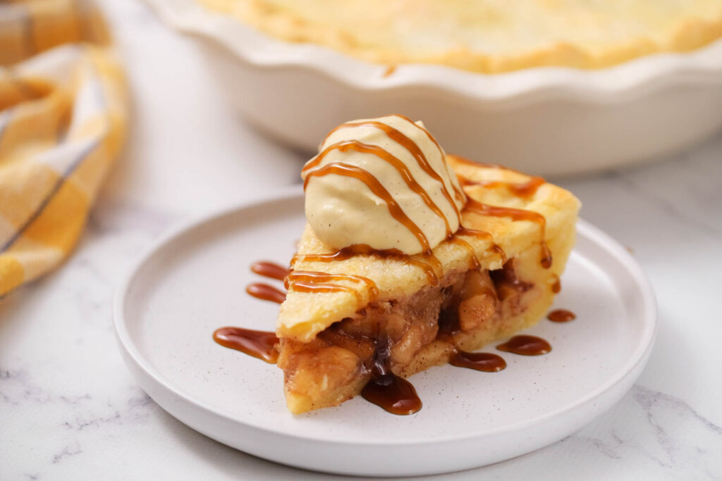 slice of pie drizzled with caramel sauce.