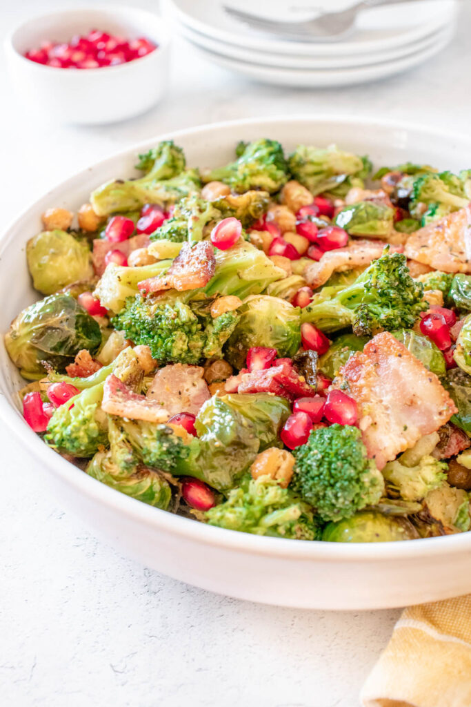 Warm Brussels Sprouts Salad with Bacon in white bowl.
