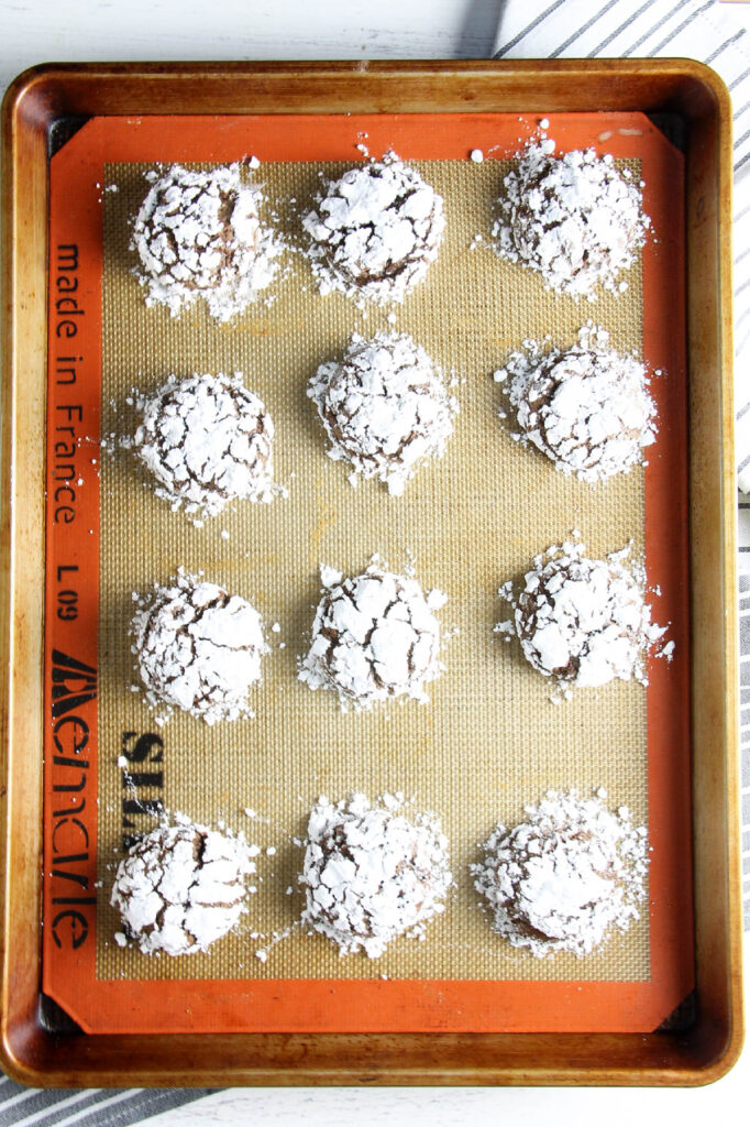 Chocolate Hazelnut Crinkle Cookies baked on tray.