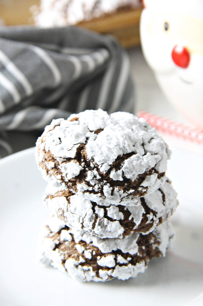 Chocolate Hazelnut Crinkle Cookies on white plate.