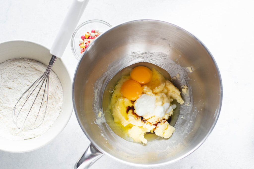 mixing wet ingredients into mixer.