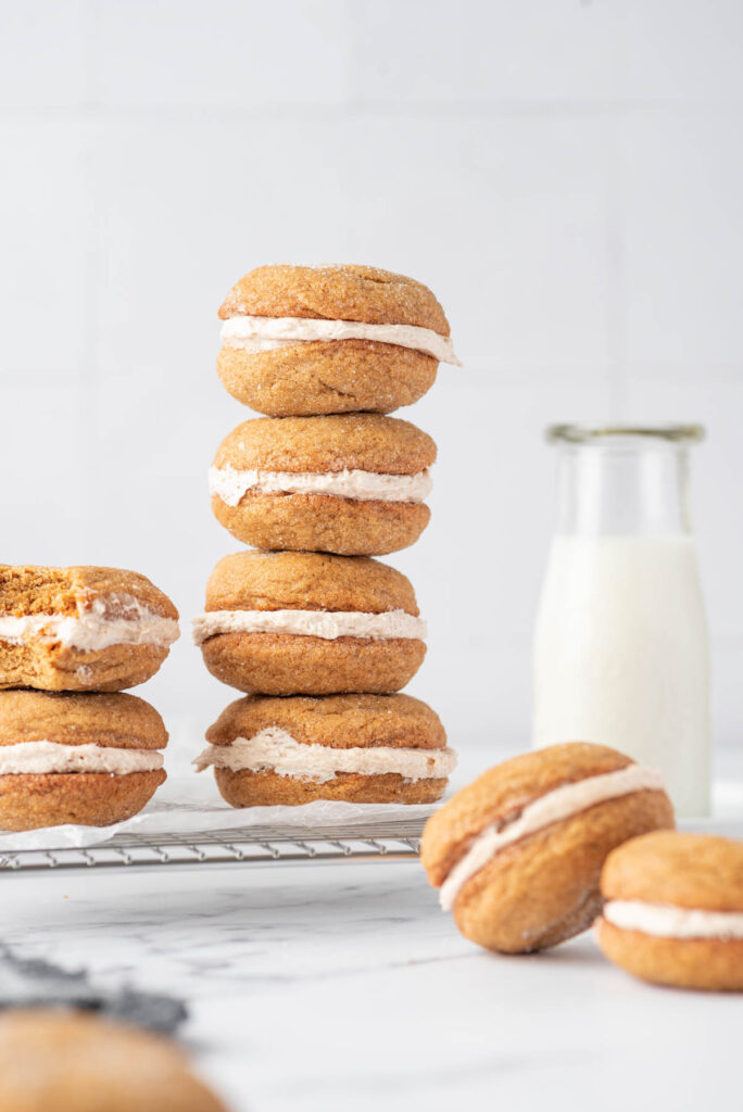 Ginger Molasses Cookie Sandwiches stacked on top of each other.