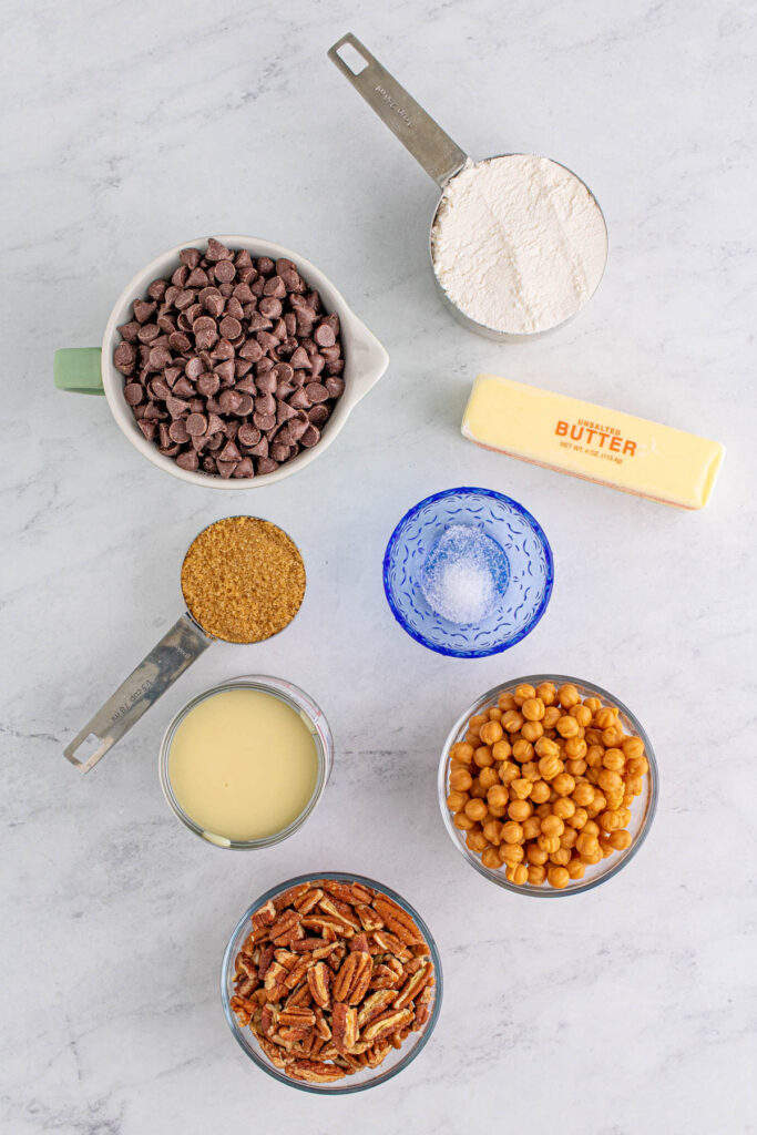 Turtle Magic Bars Ingredients in glass bowls.