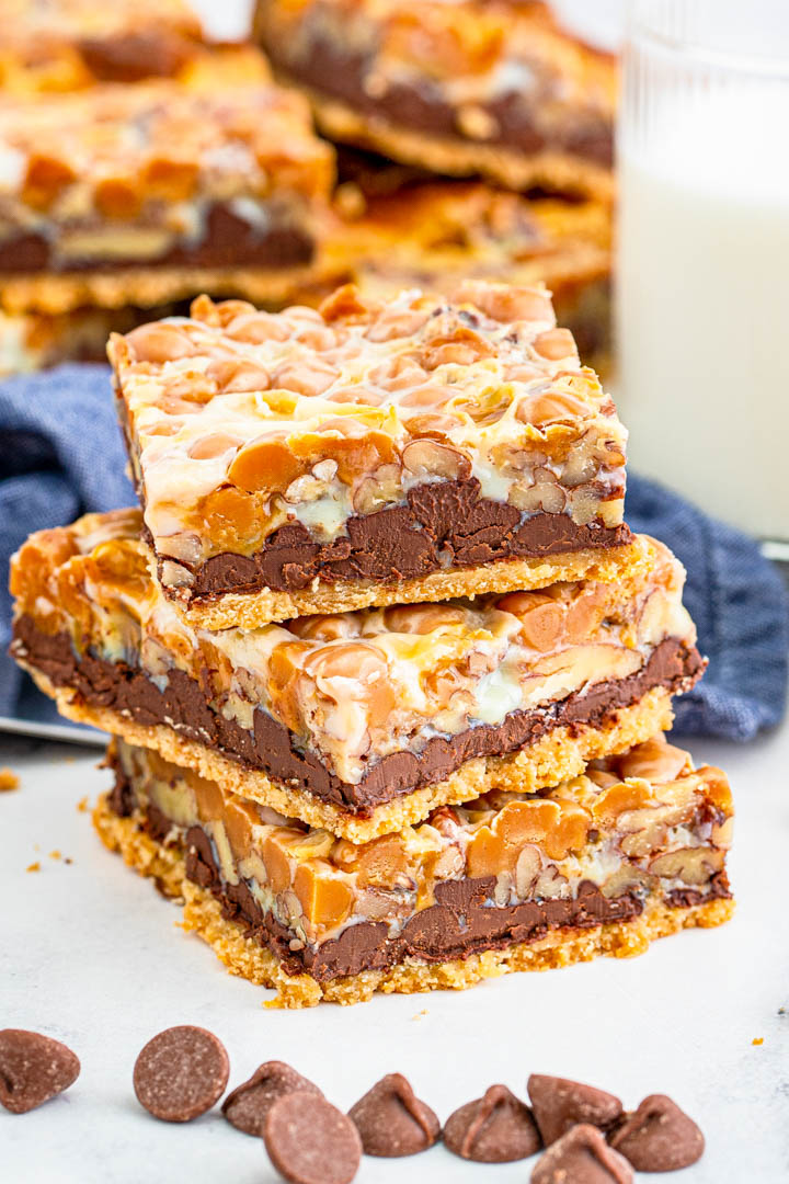 Turtle Magic Bars stacked with chocolate chips.