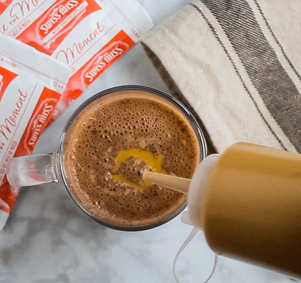 adding peanut butter to hot chocolate.