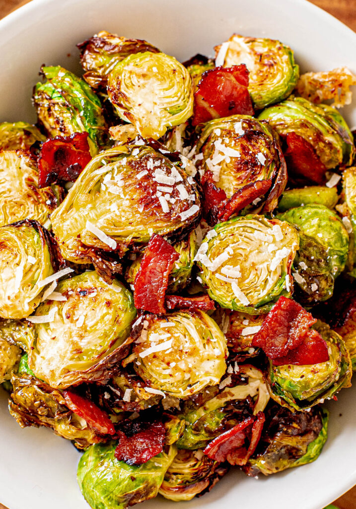 Air Fryer Brussels Sprouts in white bowl with bacon.