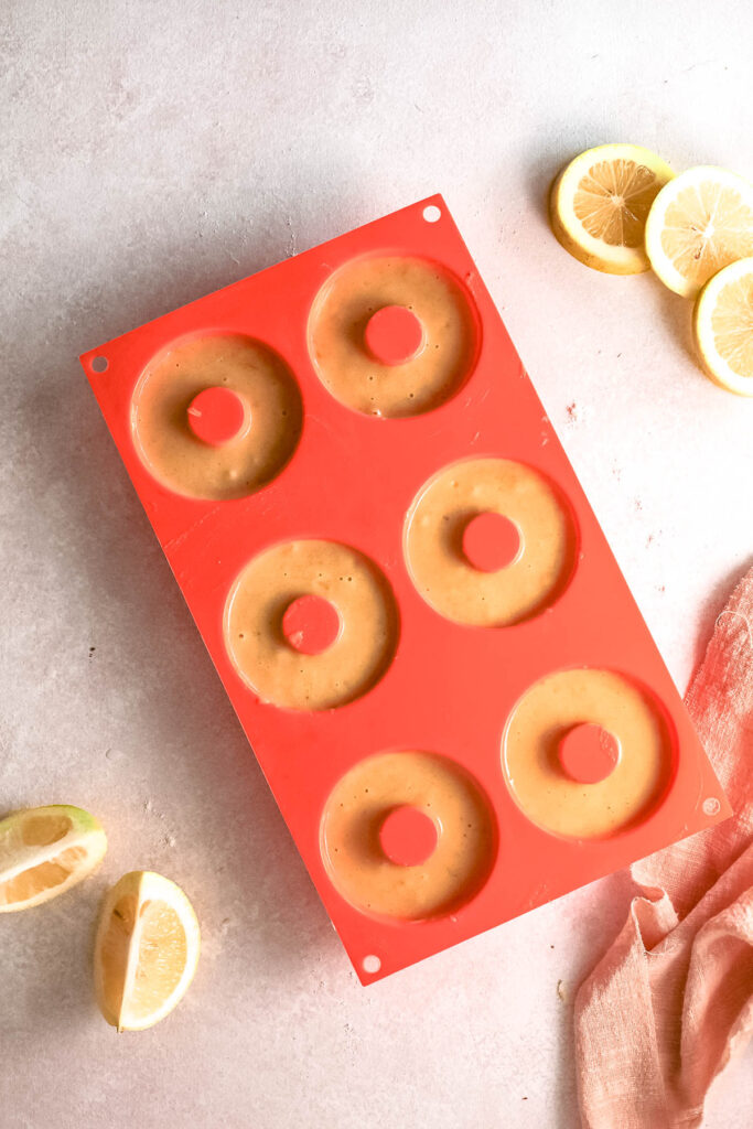 donut mixture in silicone pan.