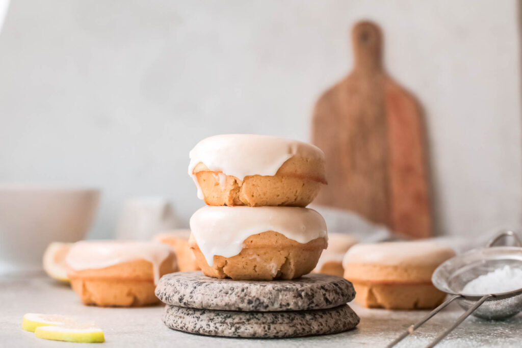 Baked Lemon Donuts stacked on each other.