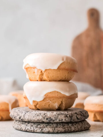 Baked Lemon Donuts stacked on each other.