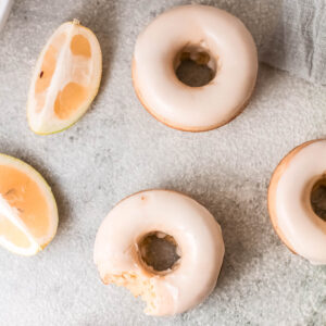 Baked Lemon Donuts on gray background.