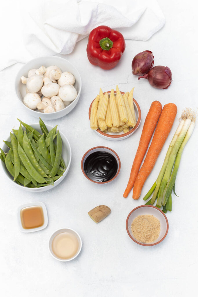 stir fry ingredients on white background.