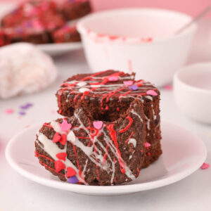 Valentines Day Brownies stacked on white plate.