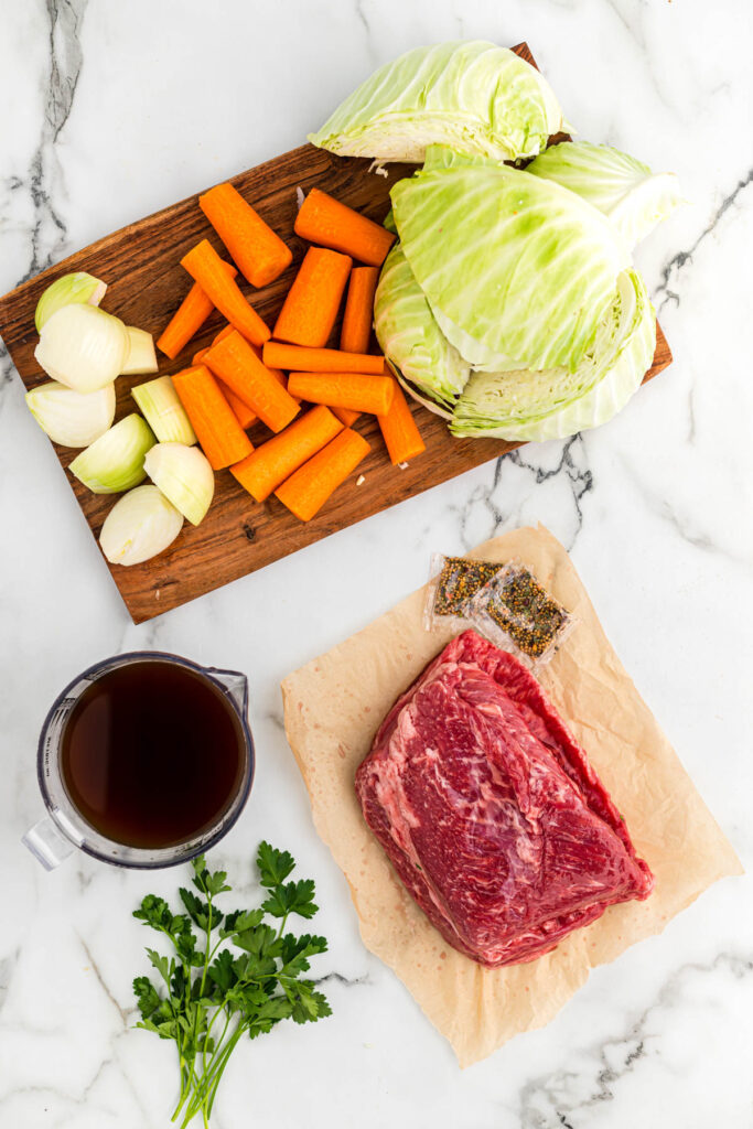 corned beef and veggies ingredients on white background.