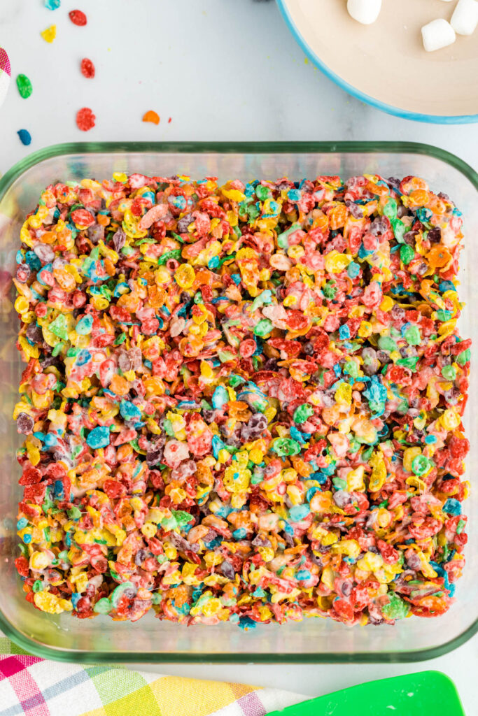 Fruity Pebbles Rice Krispie Treats in glass dish.