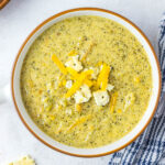 Instant Pot Broccoli Cheddar Soup in white bowl.