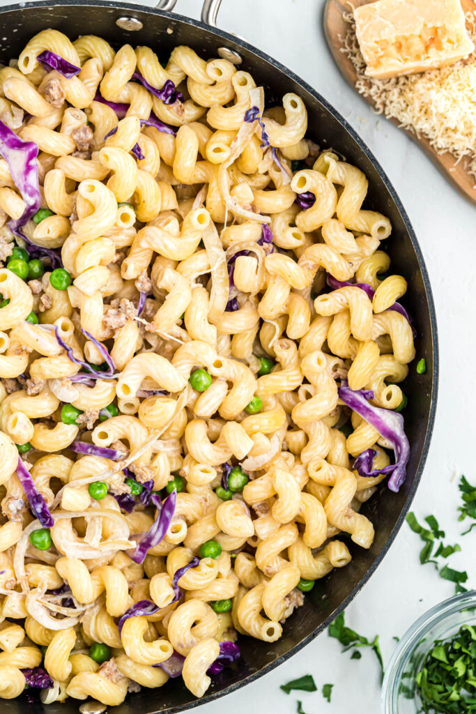 pasta with sausage in skillet.