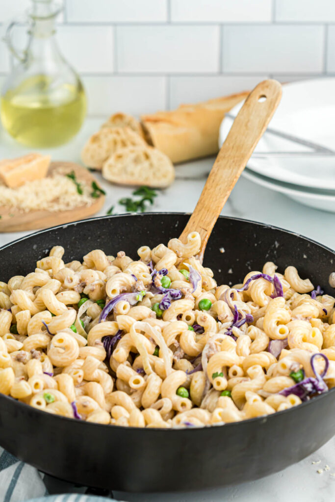 Pasta with Sausage and Radicchio in skillet with spoon.