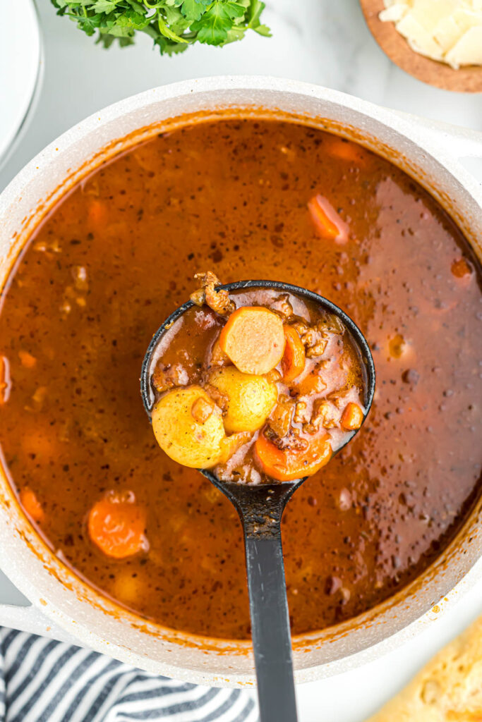 Sausage Vegetable Soup in ladle.