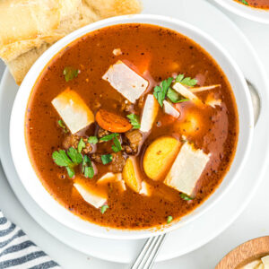 close up of soup in white bowl.