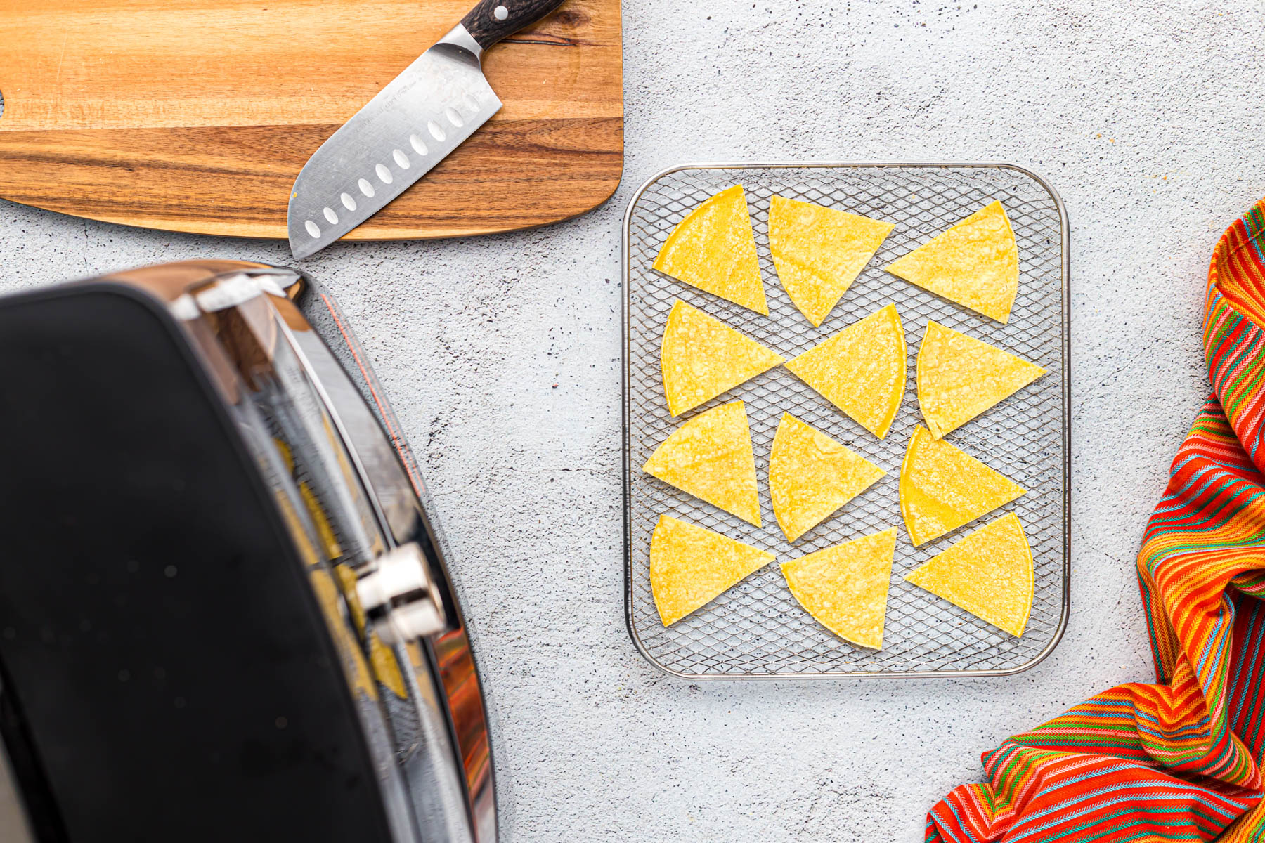 corn chips on air fryer tray.