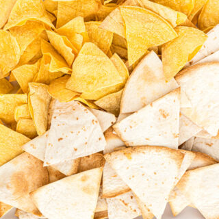 two kinds of tortilla chips on plate.