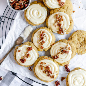 cookies on tray with cream cheese frosting.