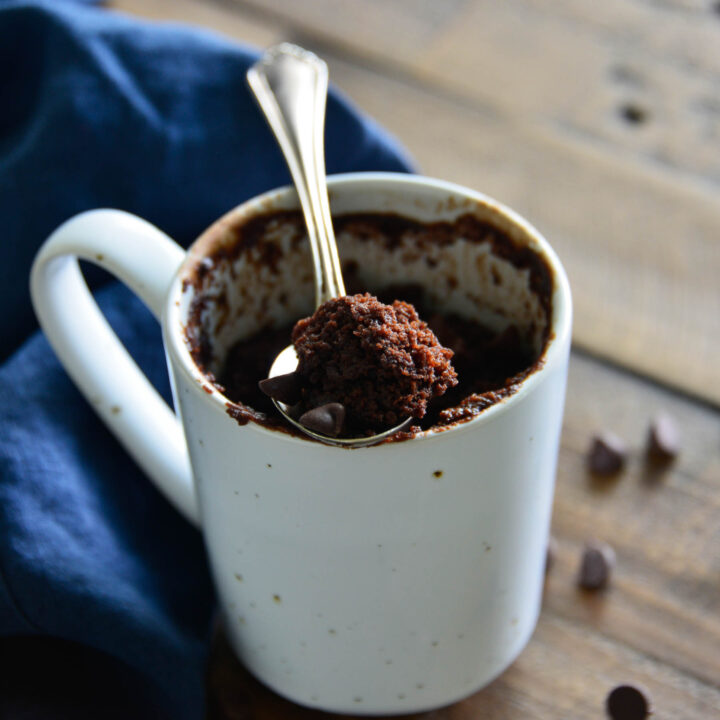 chocolate cake in cup with spoon.