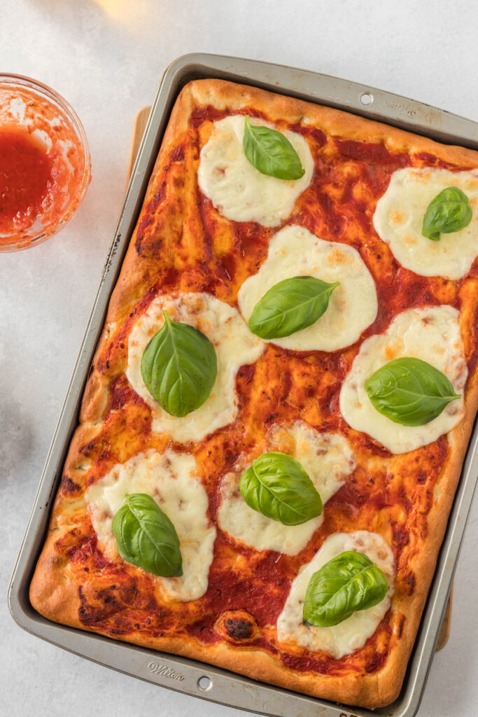 cooked pizza on sheet pan.