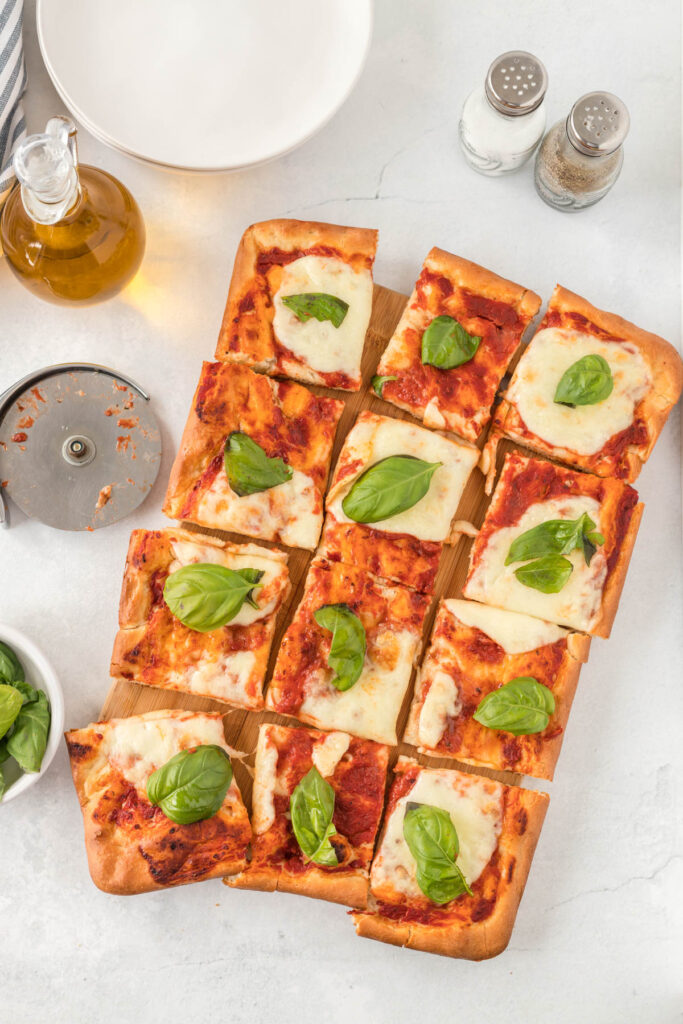 overhead view of Sheet Pan Margherita Pizza with basil.