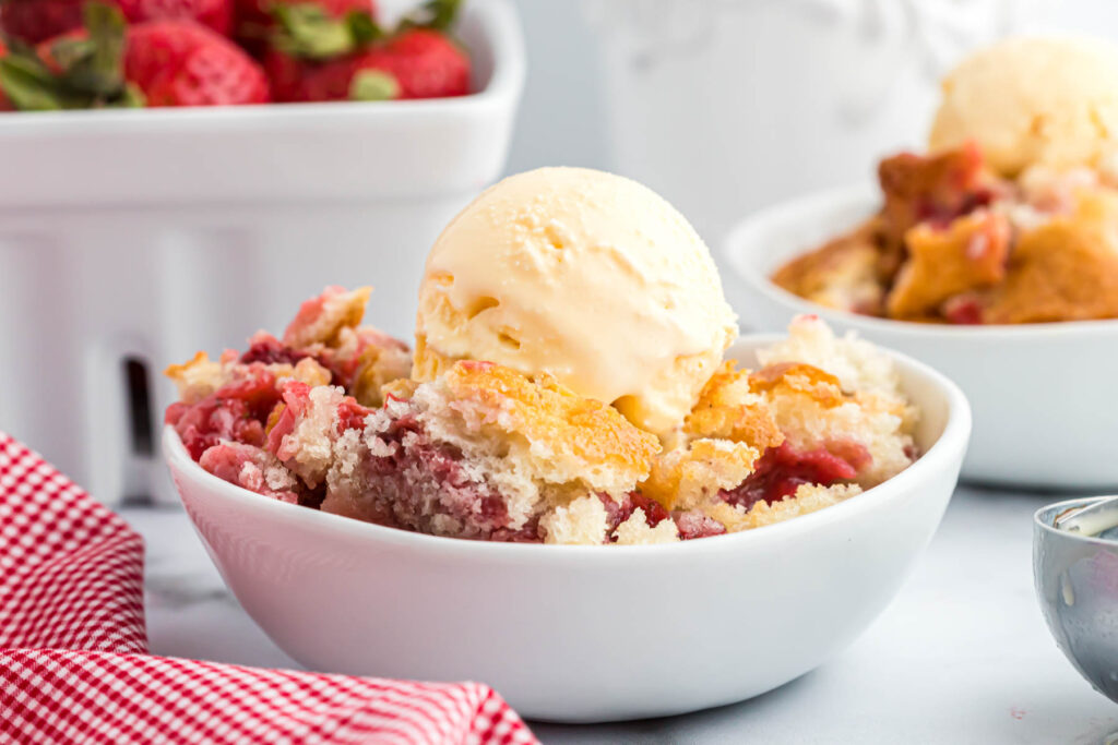 Strawberry Cobbler topped with ice cream.