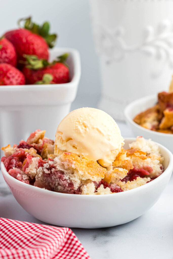 Strawberry Cobbler in white bowl.