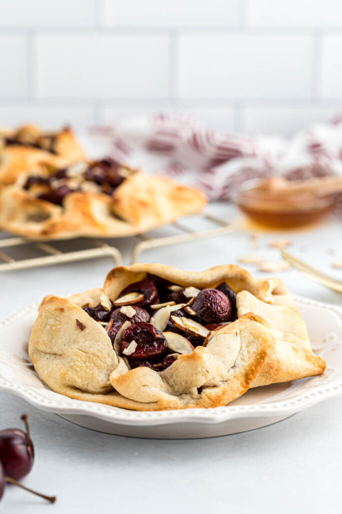 Mini Cherry Almond Galettes on white plate.