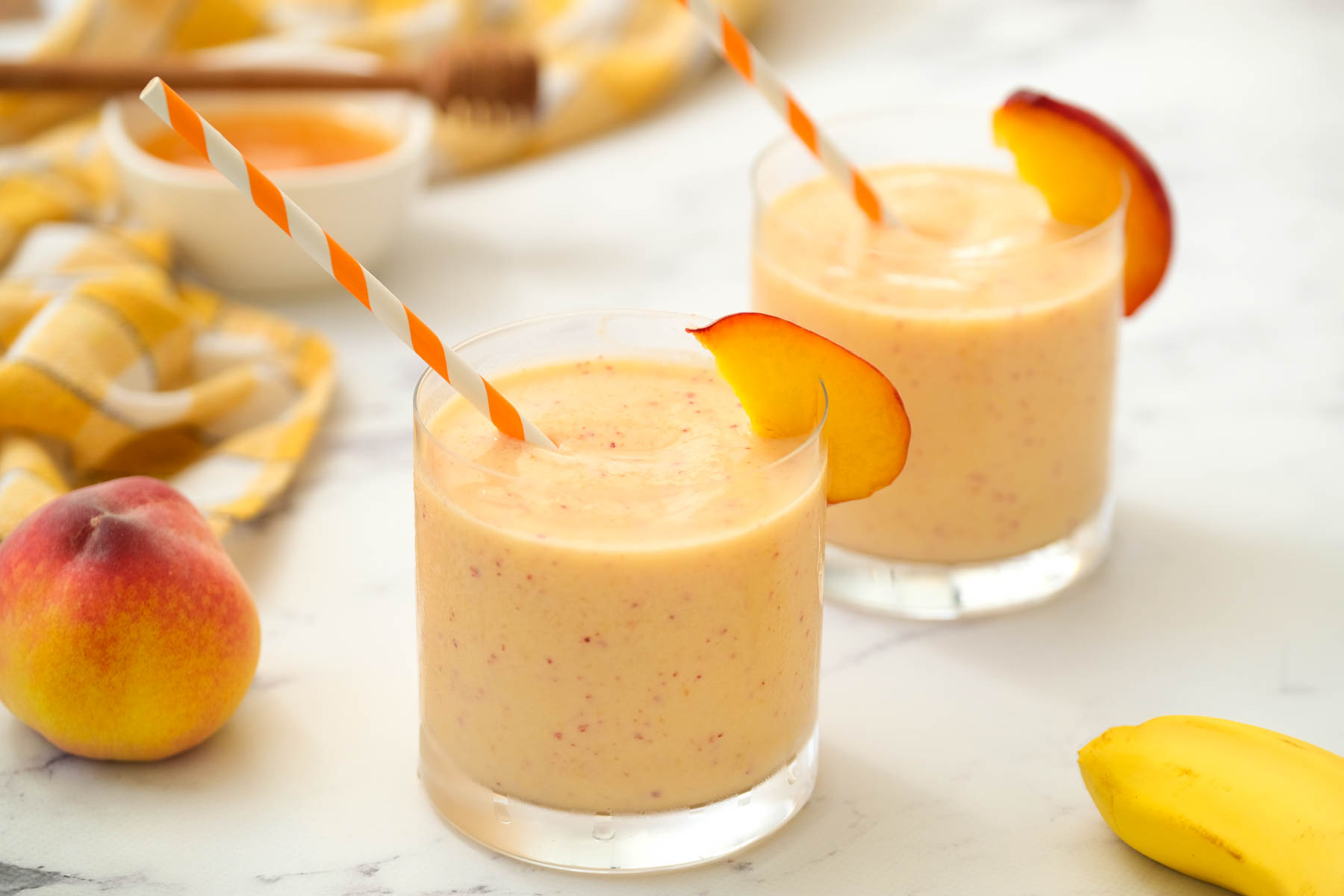 Peach Honey Yogurt Smoothie in glasses.