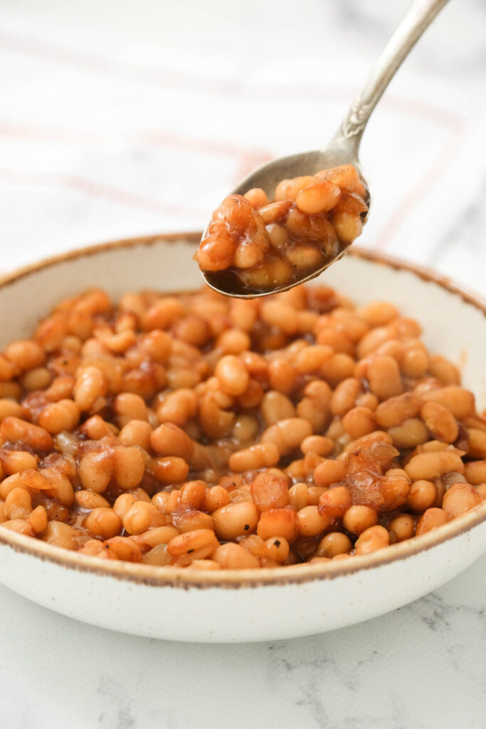 baked beans on spoon.