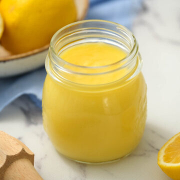 Homemade Lemon Curd in glass jar.