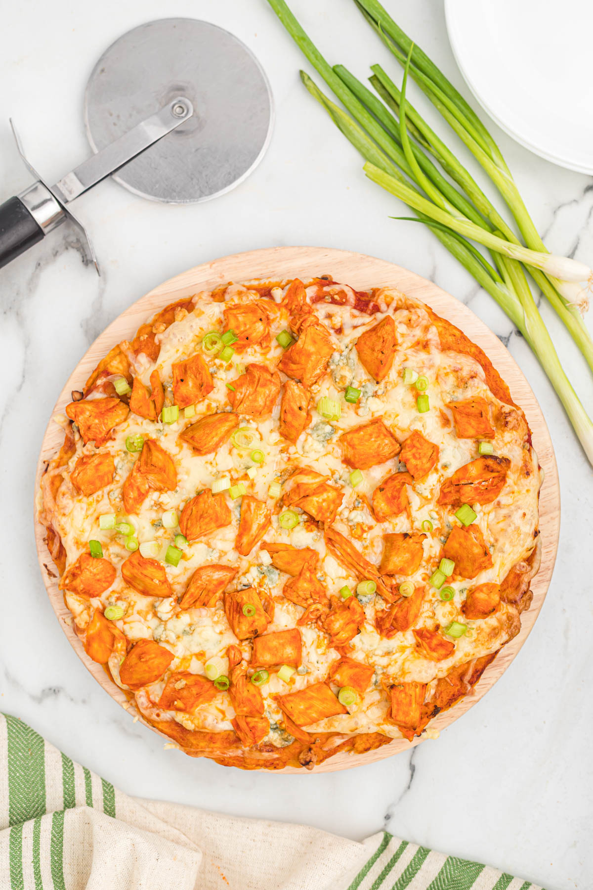 pizza with pizza cutter on white back ground.