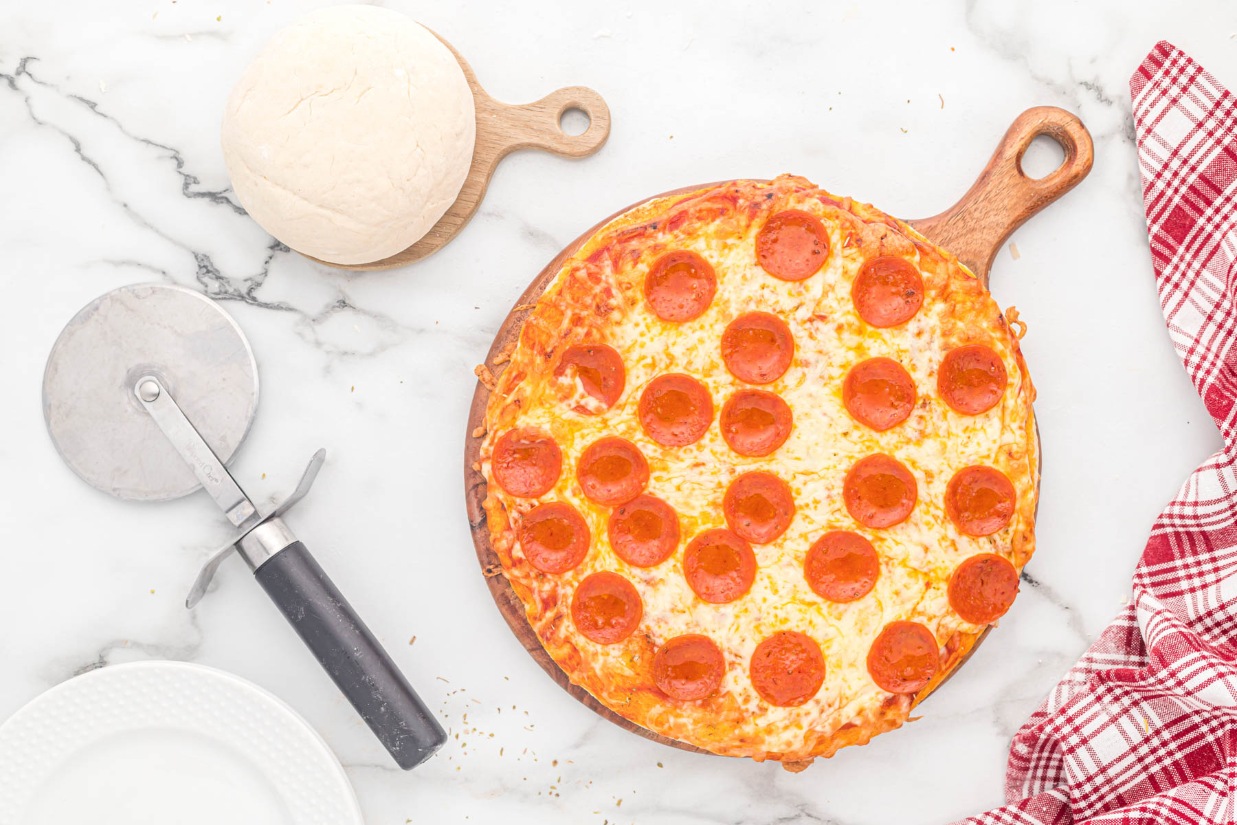 pizza on cutting board on white background.