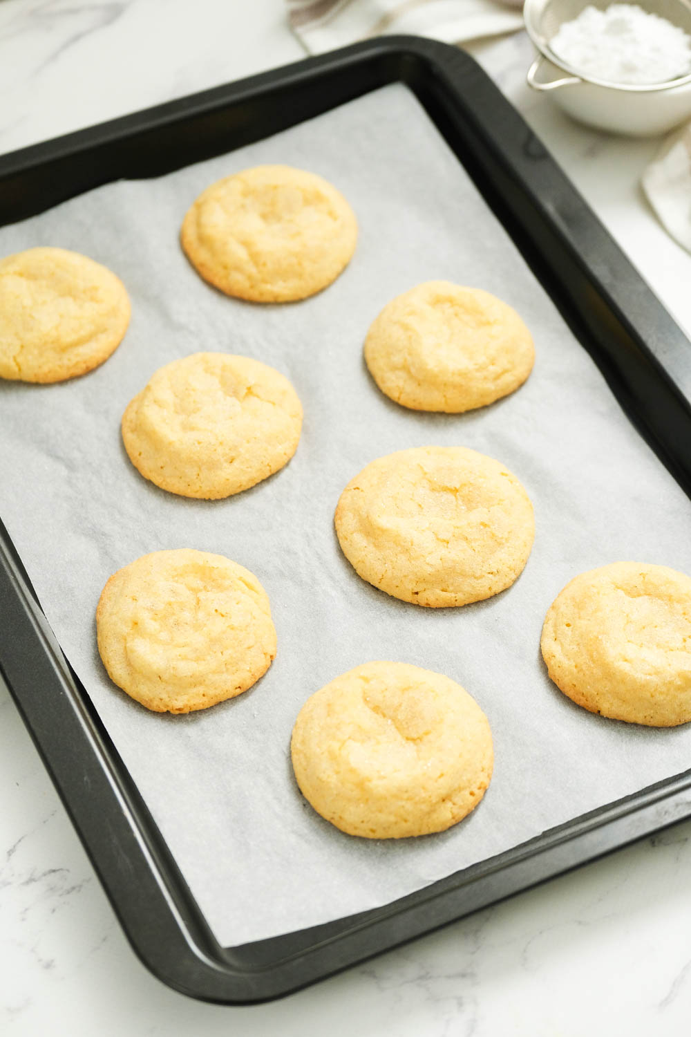 cooked cookies on sheet pan.