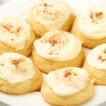 soft eggnog cookies on white plate.