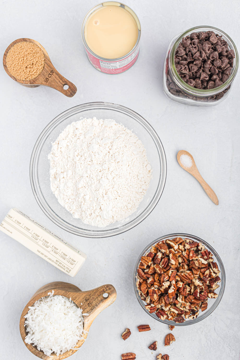 ingredients of Seven Layer Magic Bars in bowls.