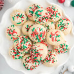 Christmas cookies on white plate.