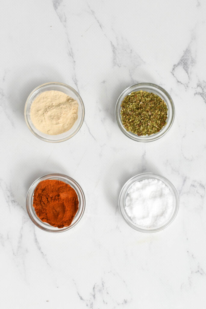 ingredients of seasonings in glass bowls.