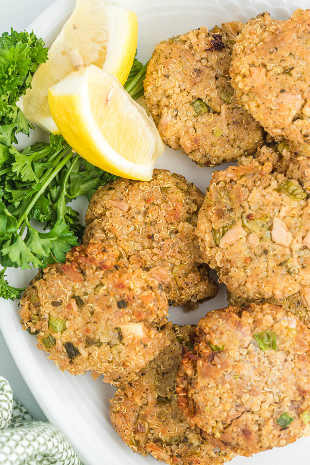 Tuna Quinoa Patties on white plate with lemon.