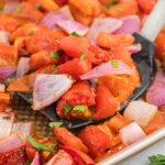 roasted tomatoes on spatula