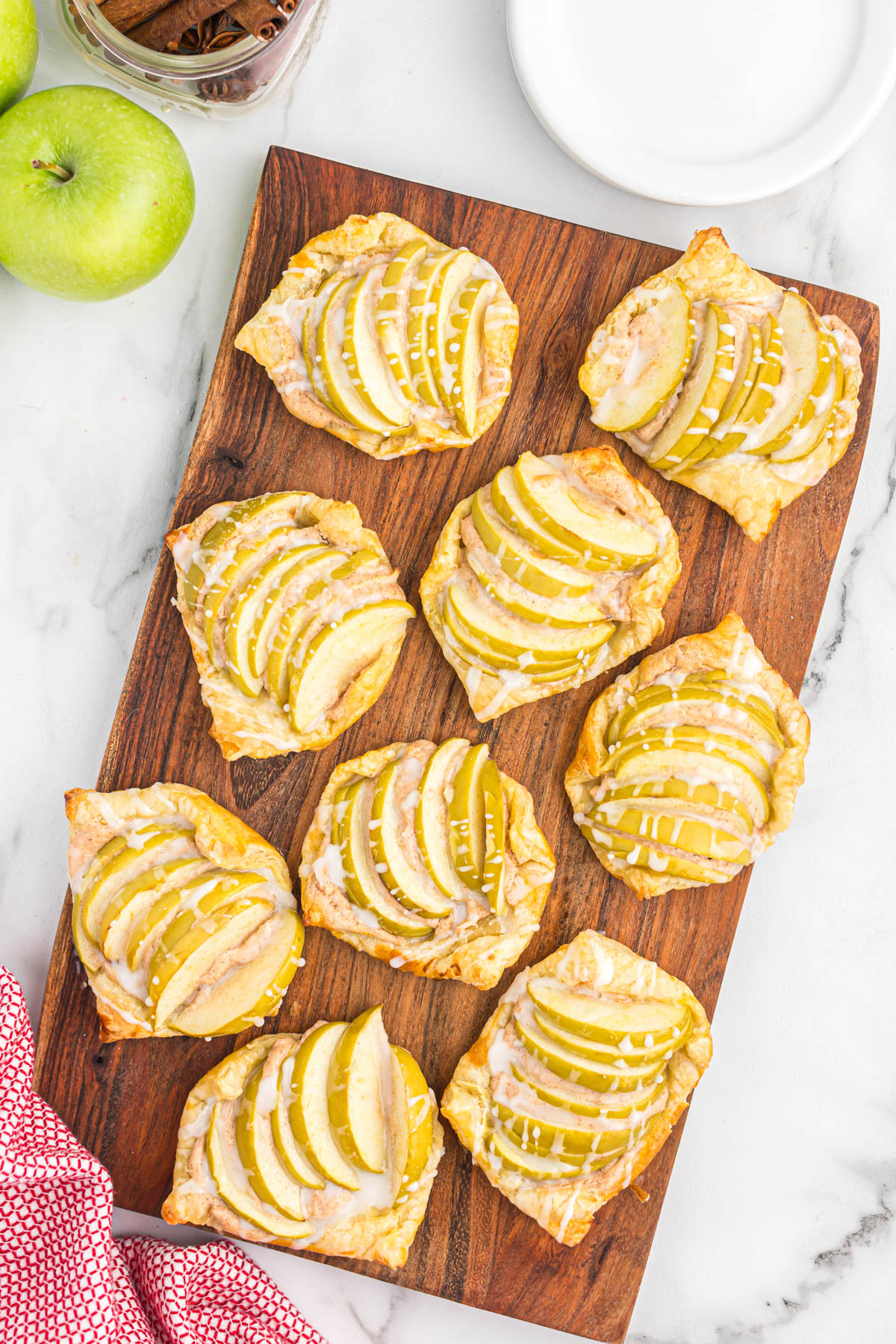 overview of Apple Cinnamon Danish Pastry on wooden cutting board