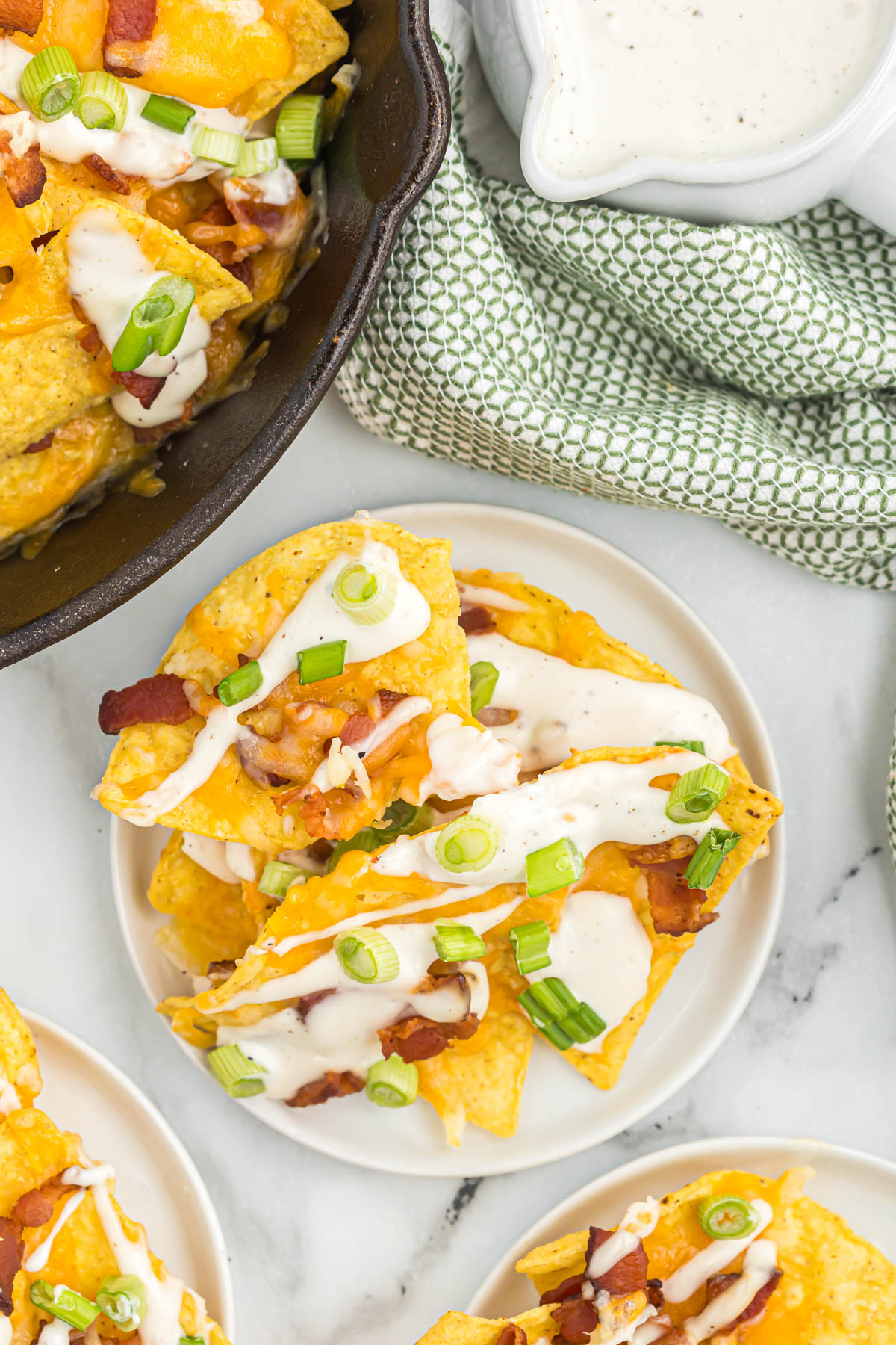 bacon nachos on white plate