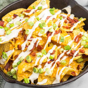 easy bacon ranch skillet nachos in black skillet