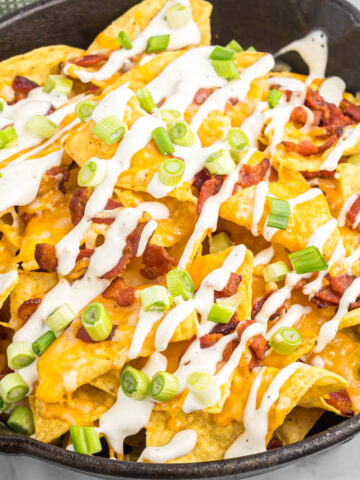 easy bacon ranch skillet nachos in black skillet