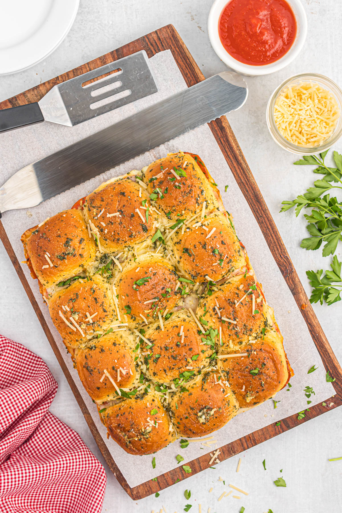 pepperoni pizza sliders on wooden cutting board